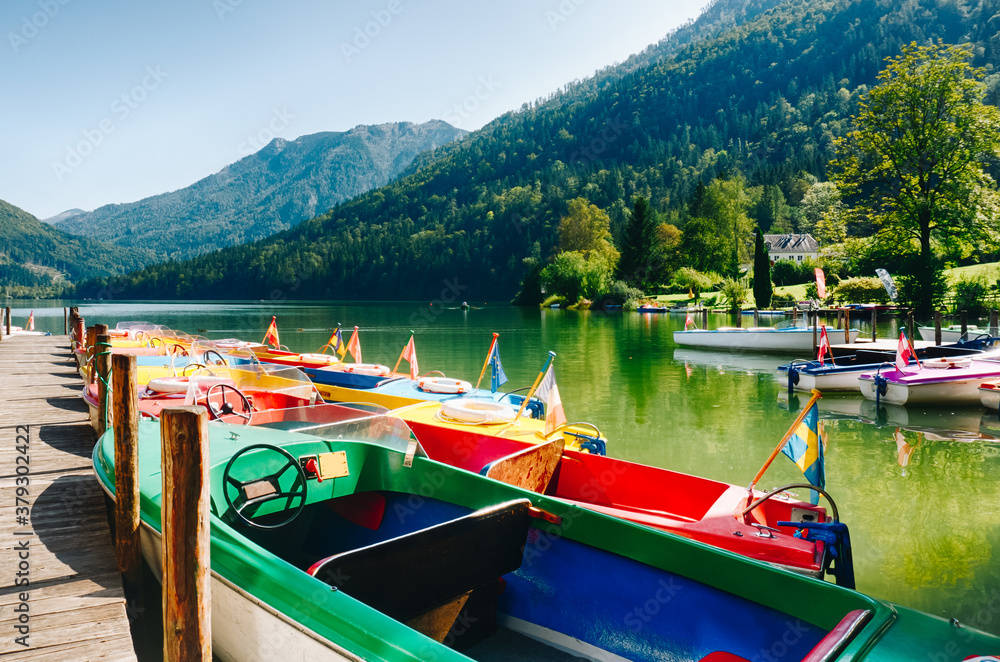Colorful rental boats on a beautiful idyllic lake.