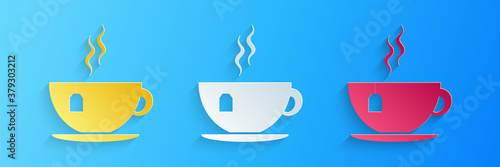 Paper cut Cup with tea bag icon isolated on blue background. Paper art style. Vector.