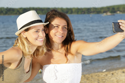 two young woman selfy in nature