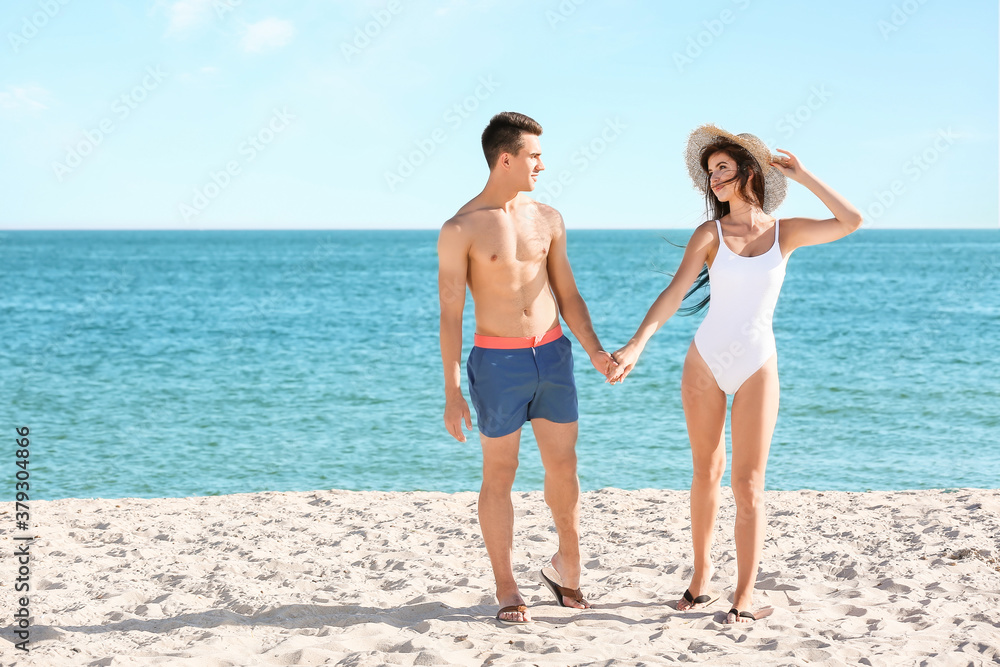 Happy young couple on sea beach