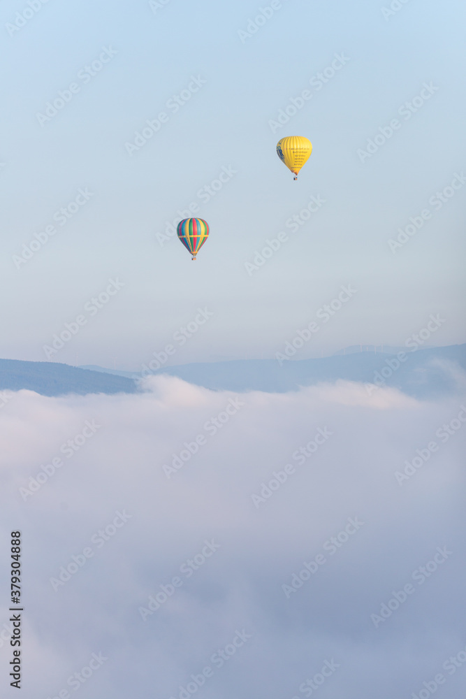 Fototapeta premium hot air balloon over the clouds