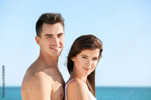 Happy young couple on sea beach © Pixel-Shot