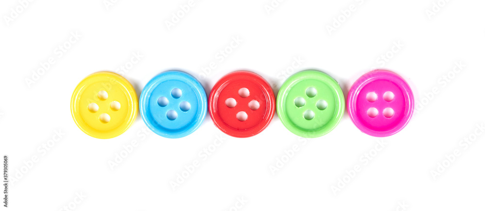 colorful plastic sewing buttons isolated on white colorful plastic sewing buttons isolated on white