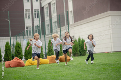 Group of children running and looking energized