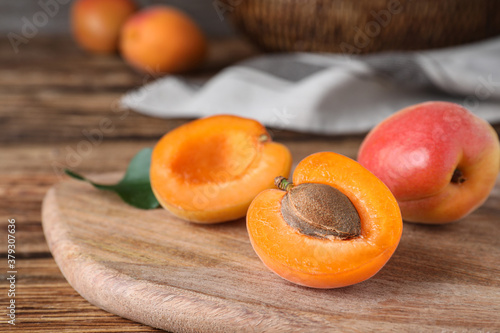 Delicious fresh ripe apricots on wooden table, closeup