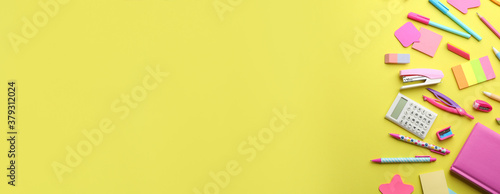 School stationery on yellow background, flat lay with space for text. Back to school