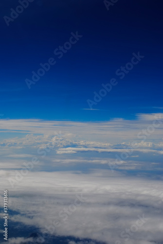 Clouds and sky from airplane window view © iniaz
