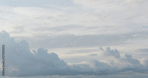 Sky background with white clouds on a foggy skyscape © GCapture