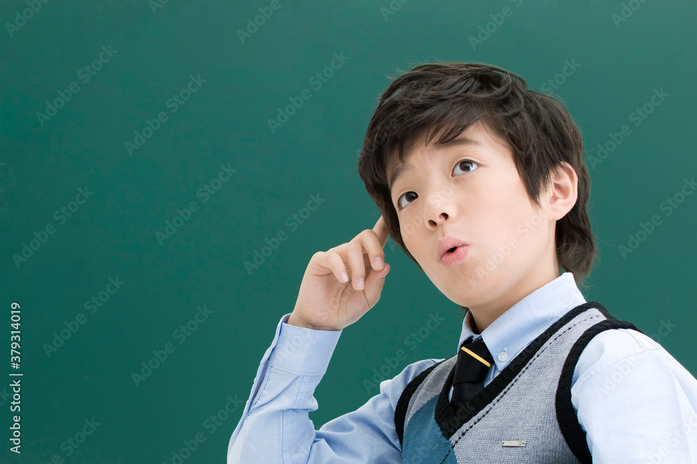 boy in front of blackboard