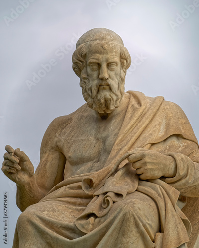 Plato statue: the ancient Greek philosopher sitting in deep thoughts, Athens Greece