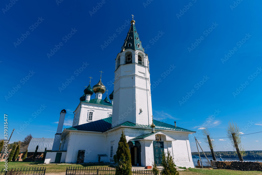 Orthodox Christian white stone Church in Russia on the banks of the Volga river