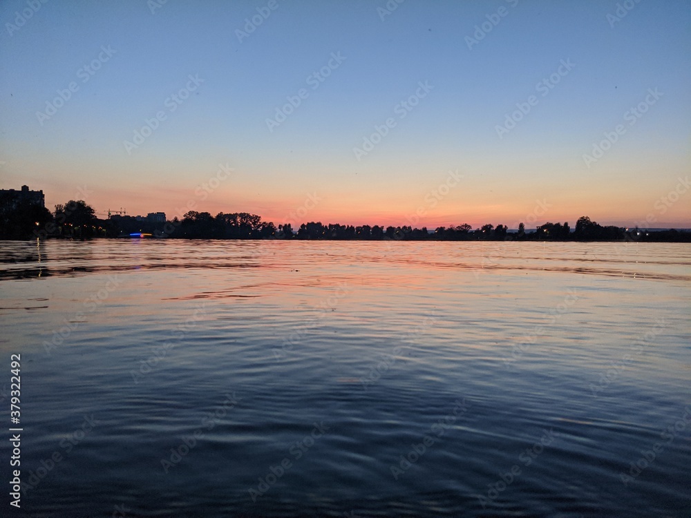 Obraz premium sunset over the river
