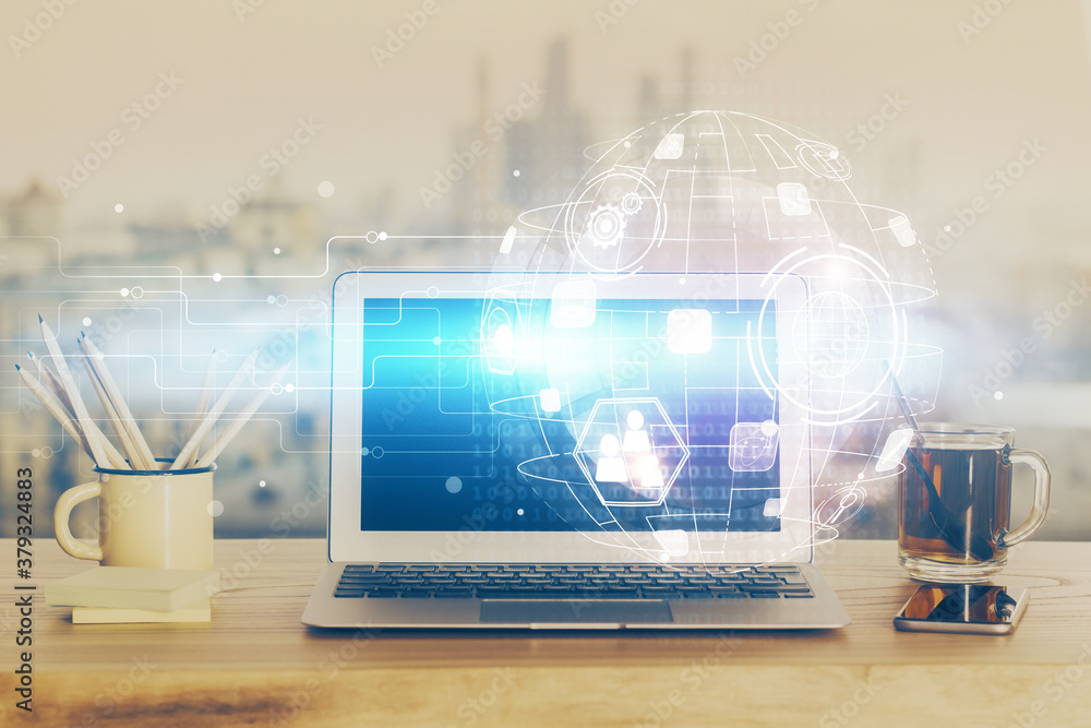 Computer on desktop with social network hologram. Multi exposure. Concept of international people connections. Computer on desktop with social network hologram. Multi exposure. Concept of international people connections.
