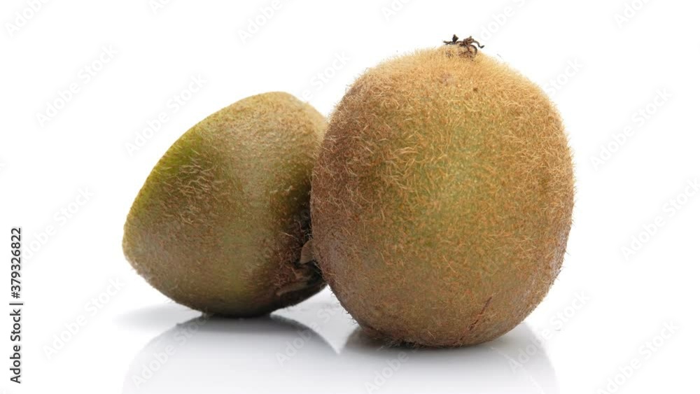Kiwi fruit and half kiwi fruit isolated on white background, Close up. Rotating shot. Kiwi fruit and half kiwi fruit isolated on white background, Close up. Rotating shot.