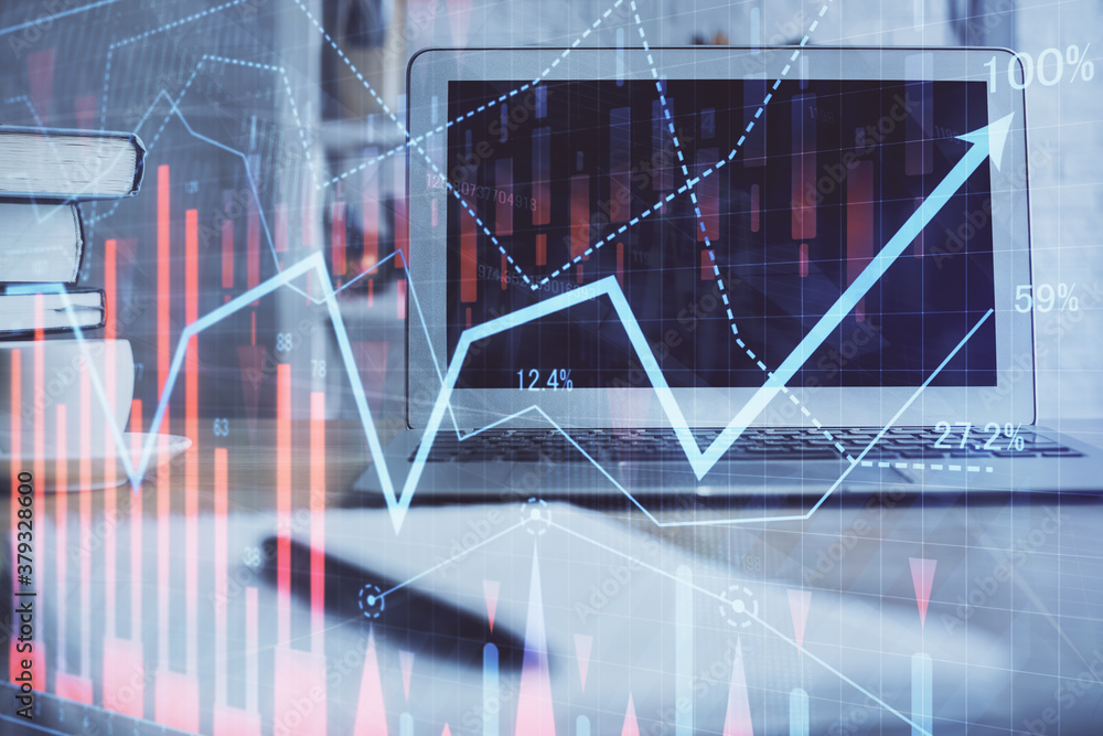 Forex market chart hologram and personal computer background. Double exposure. Concept of investment. Forex market chart hologram and personal computer background. Double exposure. Concept of investment.