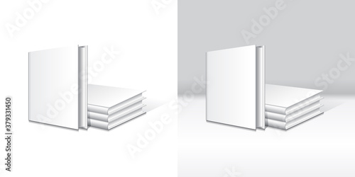 A standing book in front of a set of stacking blank white hardcover book mockup template.
