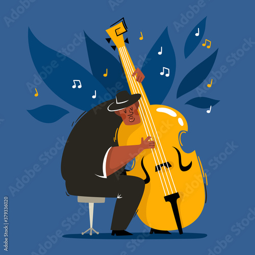 African male musician holding contrabass isolated on blue