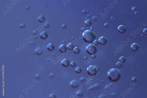 Fantastic oil drops on ble-purple background