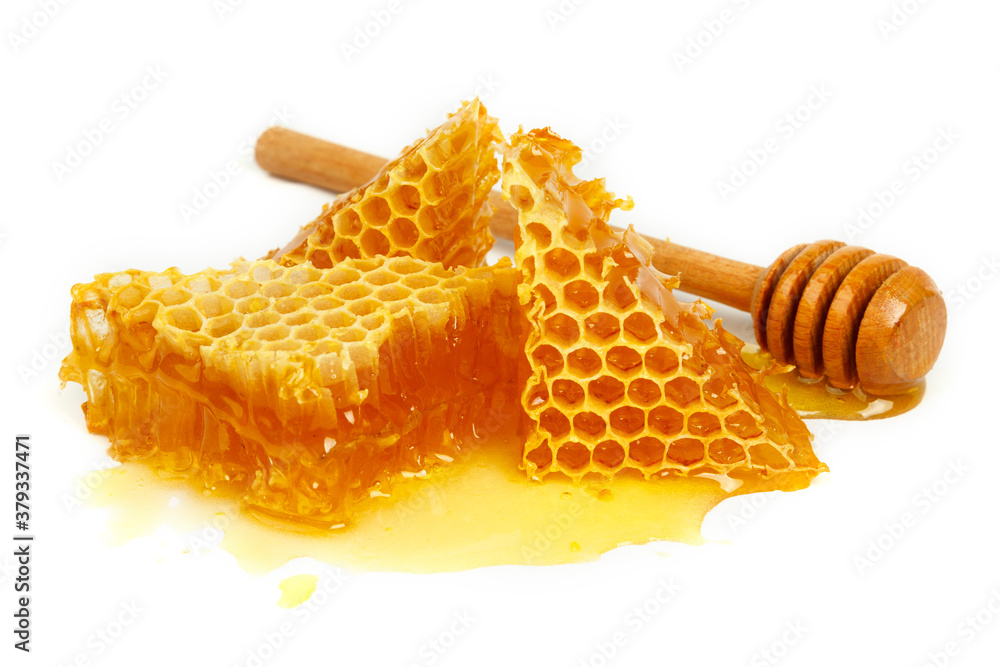 Bee combs with honey isolated on a white background. A flowing sweet dessert. A portion of a healthy and healing treat. Bee combs with honey isolated on a white background. A flowing sweet dessert. A portion of a healthy and healing treat.