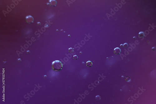 Fantastic oil drops on ble-purple background