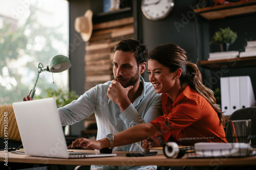 Businessman and businesswoman in office. Businesswoman and businessman working on the project photo