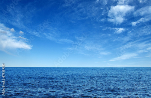 Blue sea with waves and sky © Alekss