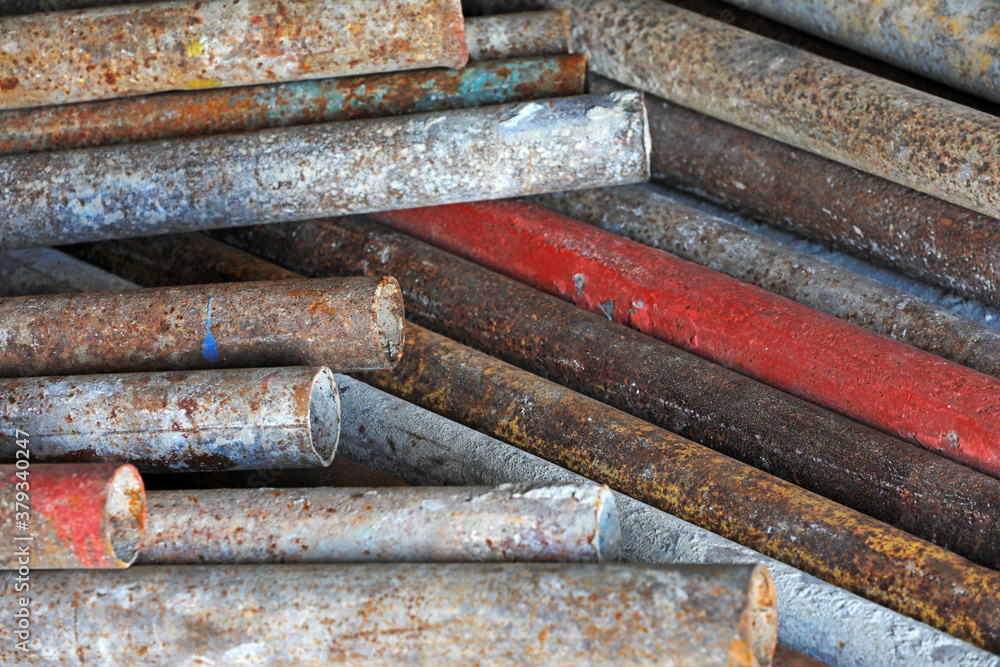 Oxidized rusty steel pipes stacked together Oxidized rusty steel pipes stacked together