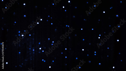 Quadro em tela Blue blurred background of LED flashing, blinking and flickering bulbs