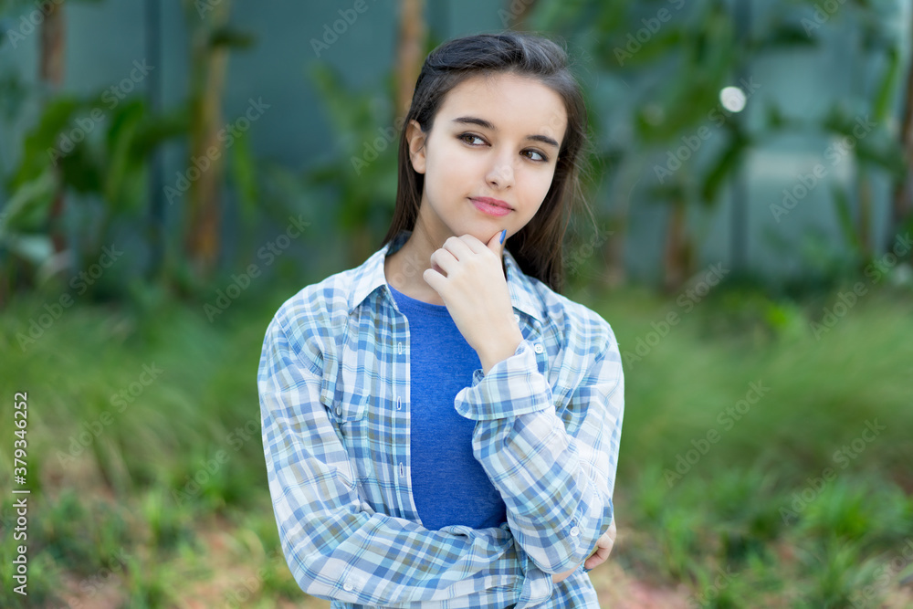 Thinking italian young adult woman with casual clothes Thinking italian young adult woman with casual clothes