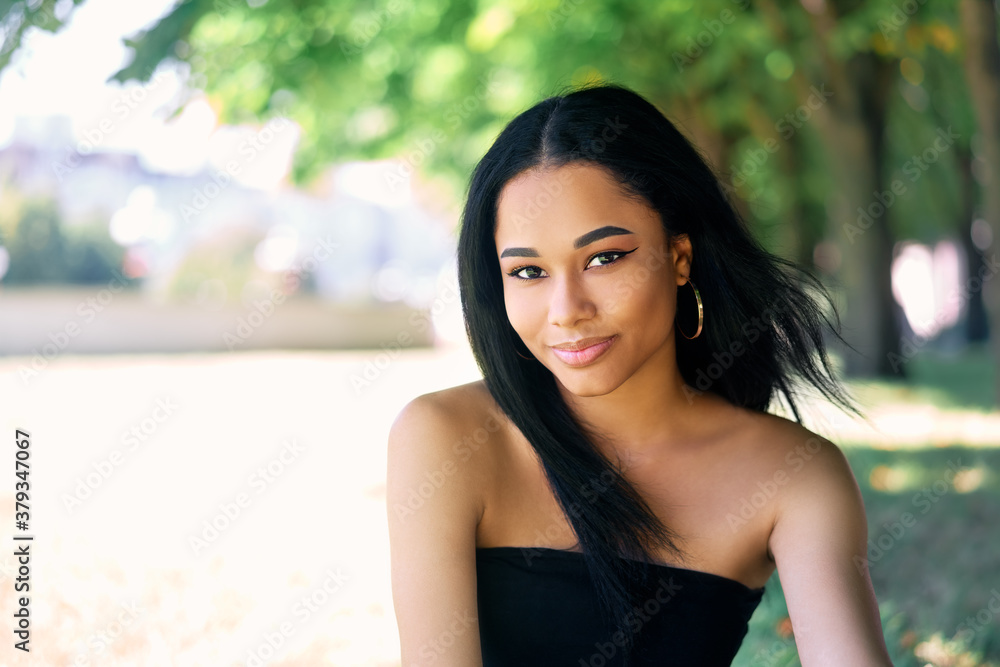 Pretty smiling afro american woman outdoors portrait Pretty smiling afro american woman outdoors portrait