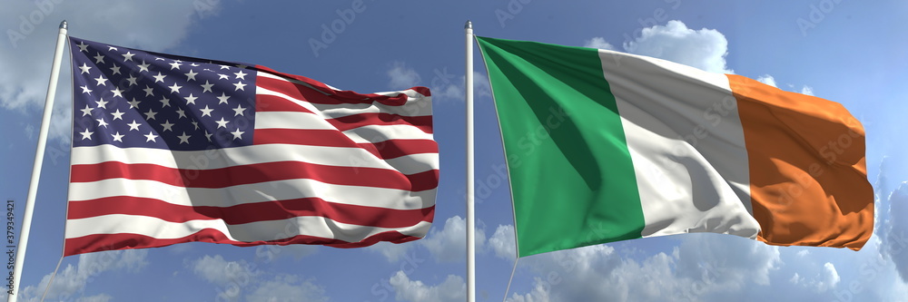 Obraz premium Flying flags of the USA and Ireland on high flagpoles. 3d rendering