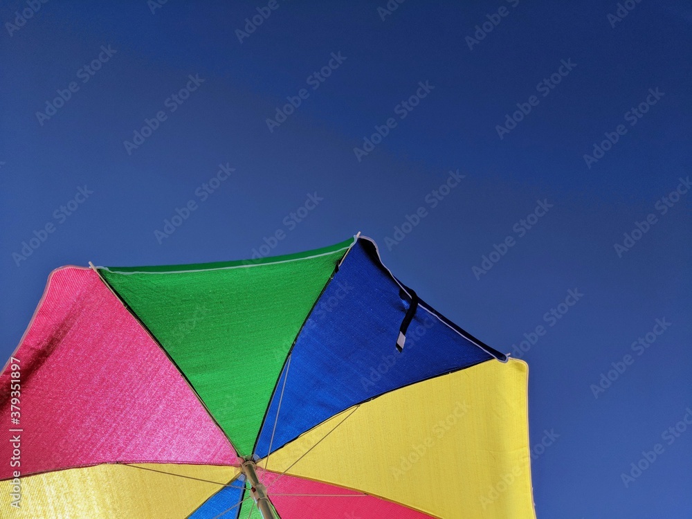 colorful umbrella on the beach colorful umbrella on the beach