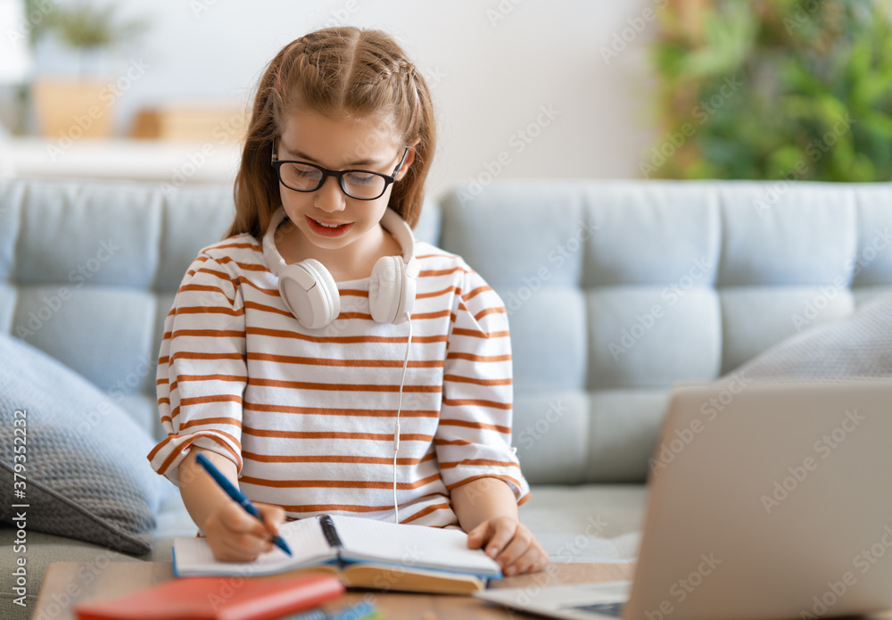 Fototapeta premium Girl doing homework or online education.