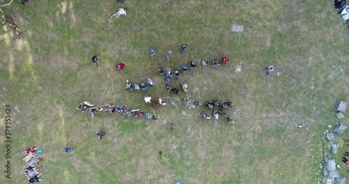 Top down dronе view of Roman legionaries during the reenactment a battle for Marcianopolis. Marcianopolis was an ancient Greek, then Roman city. It is located in nort photo