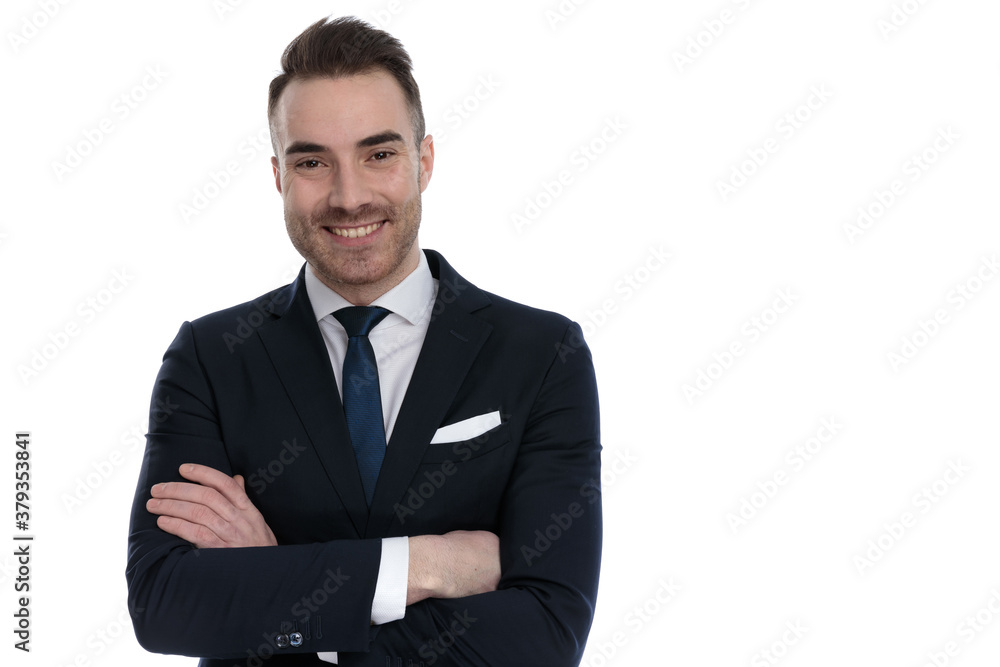 Happy businessman smiling with arms crossed at his chest Happy businessman smiling with arms crossed at his chest
