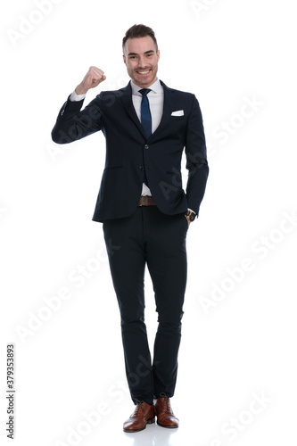 Cheerful businessman celebrating with fist in the air