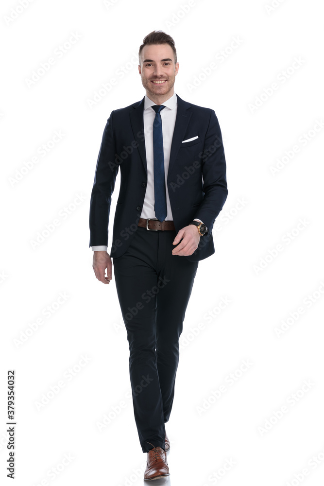 Positive businessman smiling and wearing suit while stepping Positive businessman smiling and wearing suit while stepping