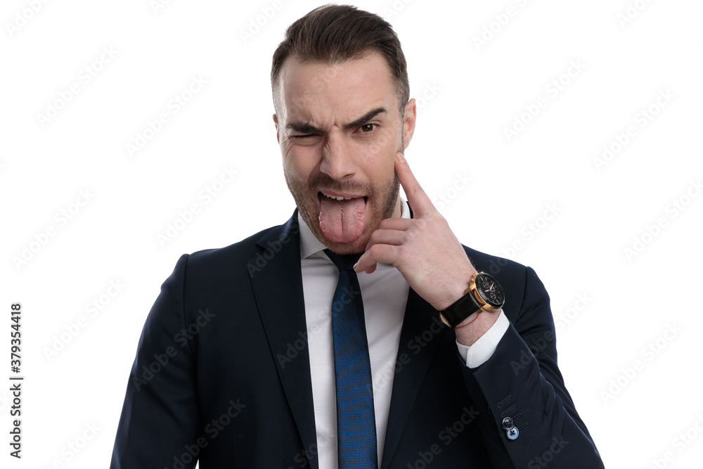 Disgusted businessman winking and sticking out his tongue Disgusted businessman winking and sticking out his tongue