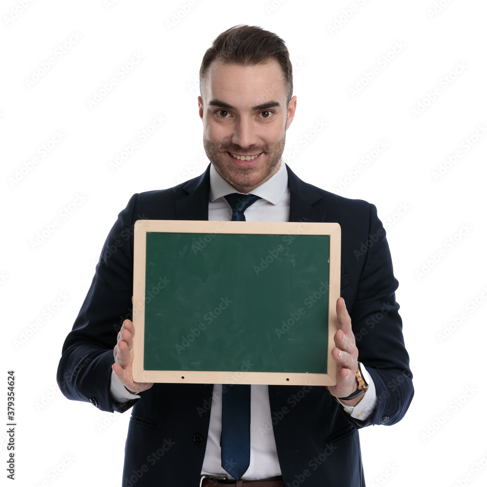 Happy businessman presenting blackboard and smiling Happy businessman presenting blackboard and smiling