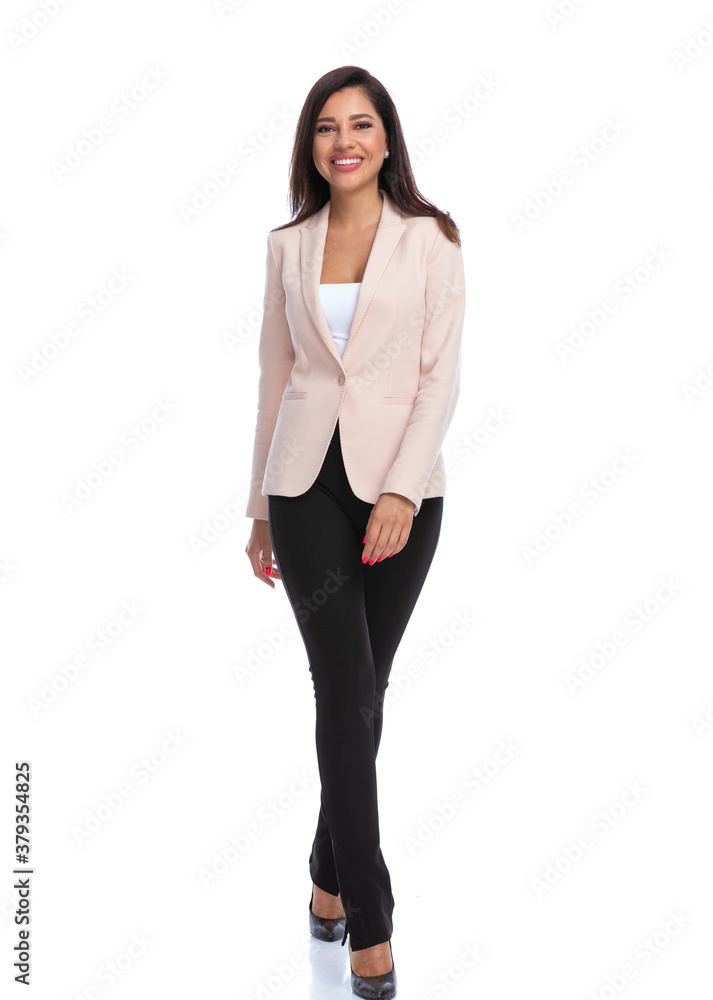 Positive businesswoman smiling and walking Positive businesswoman smiling and walking