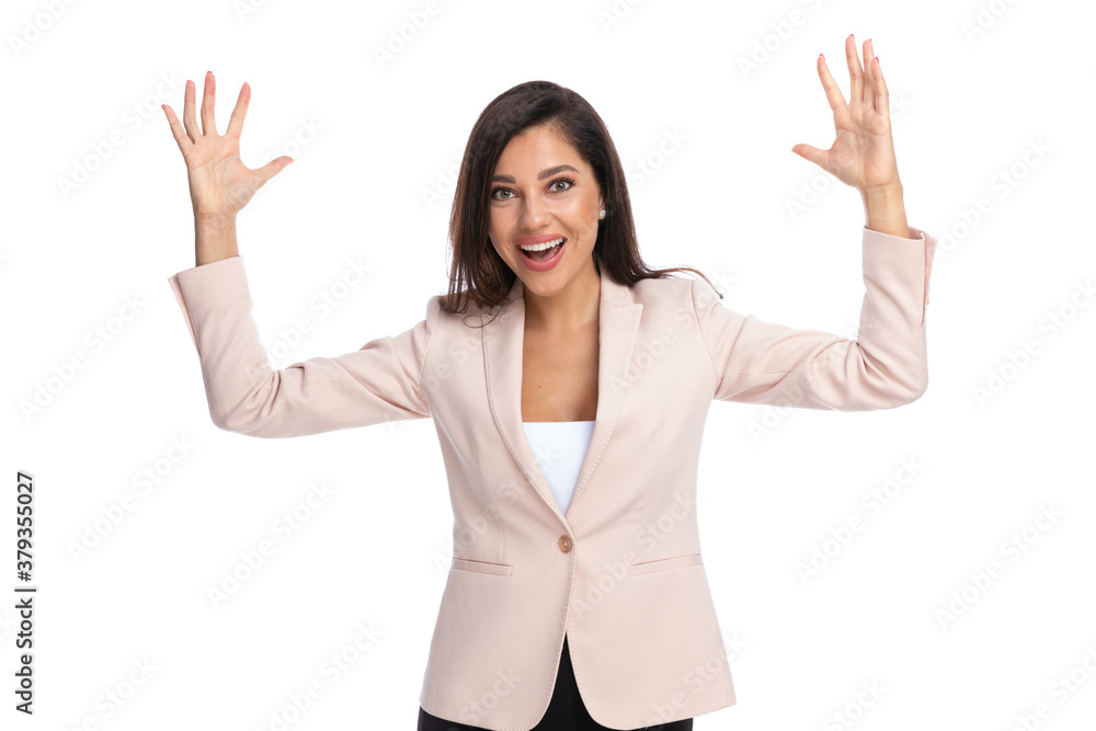 Cheerful businesswoman laughing with hands in the air Cheerful businesswoman laughing with hands in the air