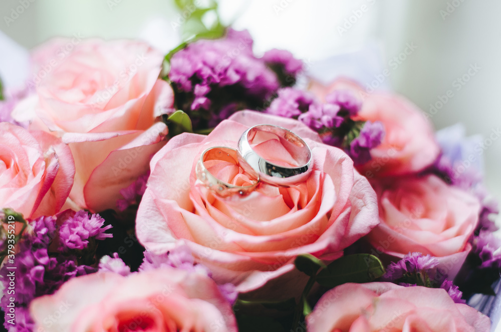 Closeup of beautiful pink rose bouquet held by a gracious bride Closeup of beautiful pink rose bouquet held by a gracious bride