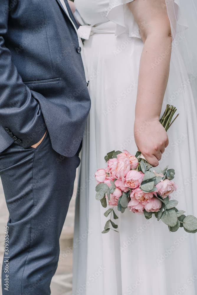 wedding bouquet in bride's hands, close up wedding bouquet in bride's hands, close up