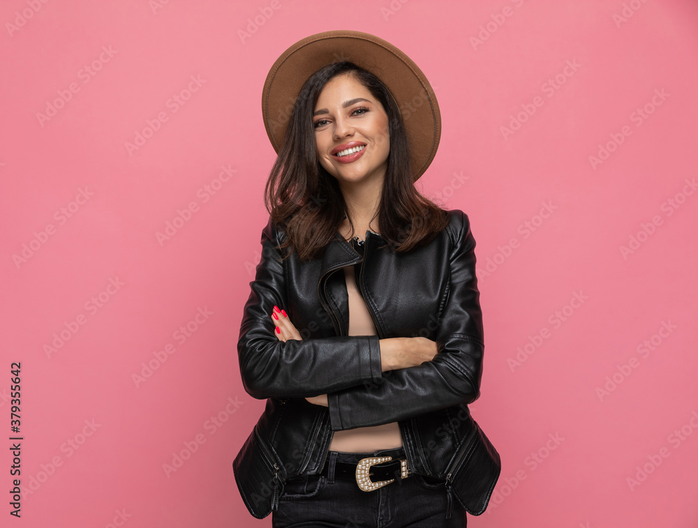 Happy fashion model holding hands folded and smiling