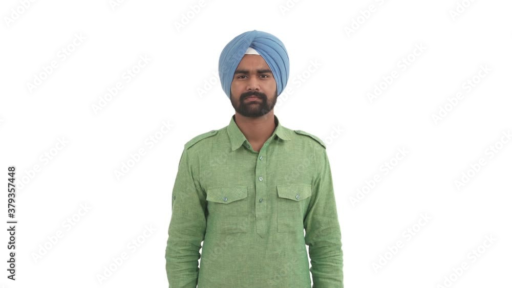 Young beard Indian man pointing at camera and twisting index finger near his head. Crazy hand offensive gesture. Isolated on white background Young beard Indian man pointing at camera and twisting index finger near his head. Crazy hand offensive gesture. Isolated on white background