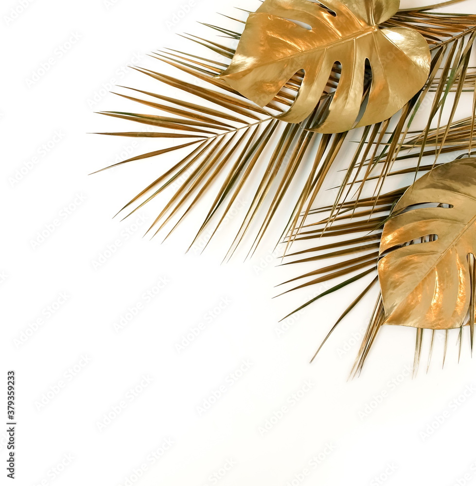 Obraz premium Gold leaf isolated on a white background top view. Golden monstera leaves frame with copy space. abstract poster.