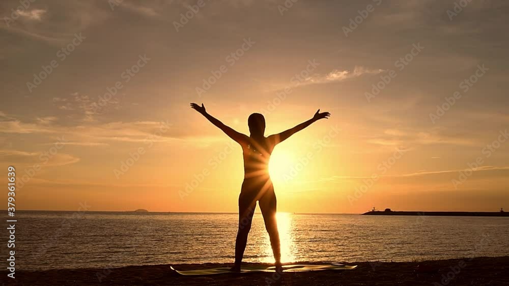 Silhouette woman make practice yoga and meditation for healthy with twilight sky background Silhouette woman make practice yoga and meditation for healthy with twilight sky background