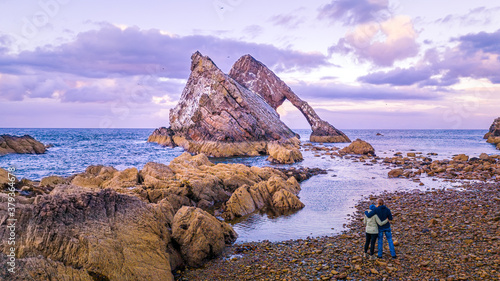 Bow Fiddle Rock during sunset - A natural sea arch near Portknockie on the north-eastern coast of Scotland