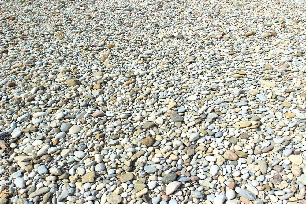 Colorful rounded rocks, pebbles on the river coast Colorful rounded rocks, pebbles on the river coast