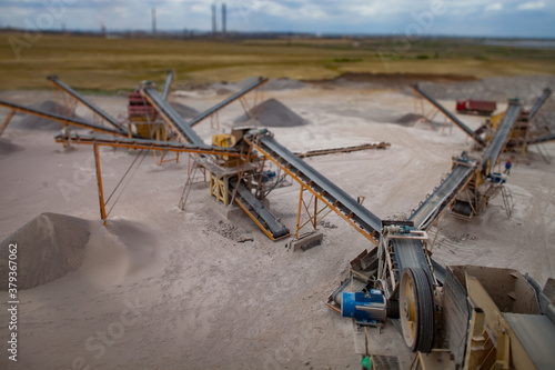 Karaganda/Kazakhstan - June 08 2012: Rock crushing plant. Gravel separation machine. Construction materials production. photo
